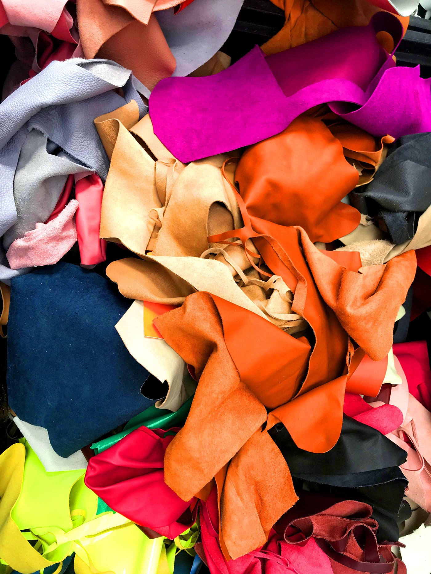 Upcycled premium leather offcuts sorted in the ISLI Studio workshop