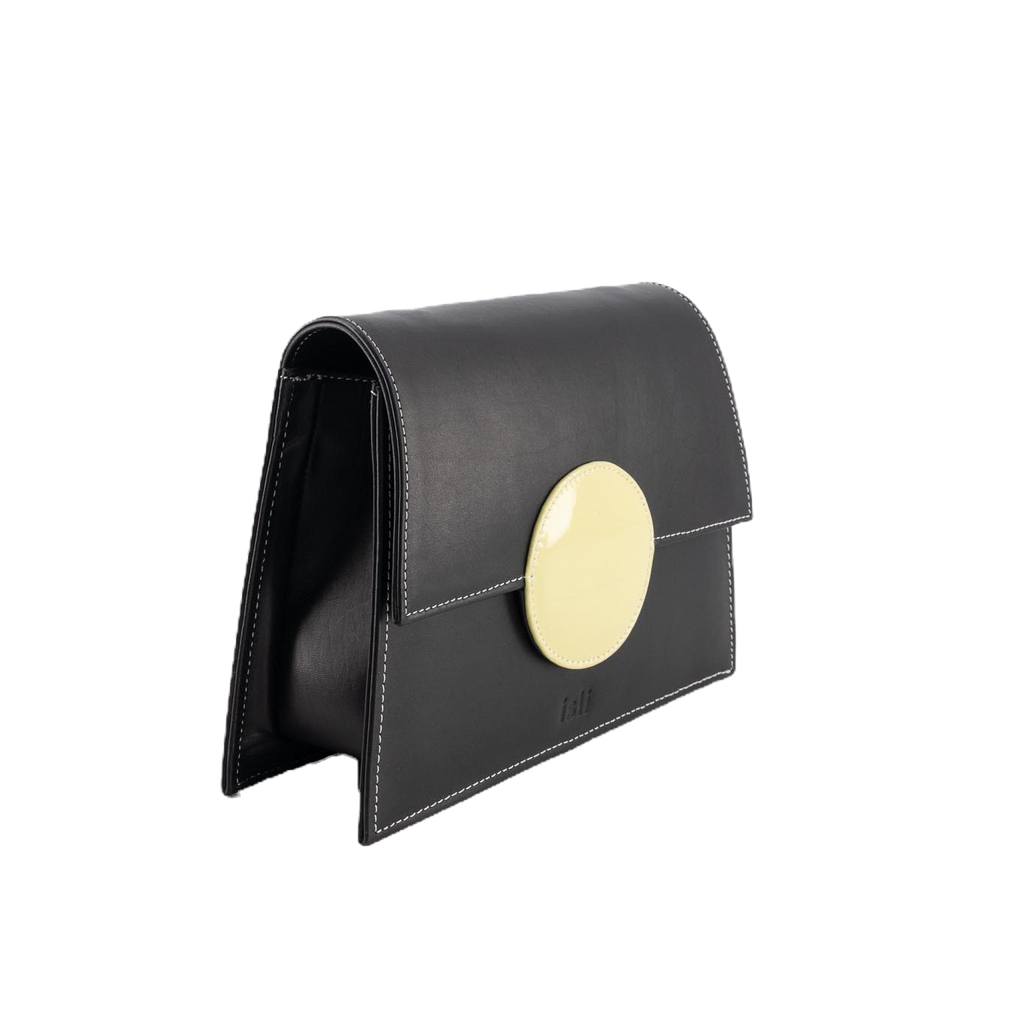 Moonlight handmade leather bag by ISLI Studio, angled view showing black and yellow contrast