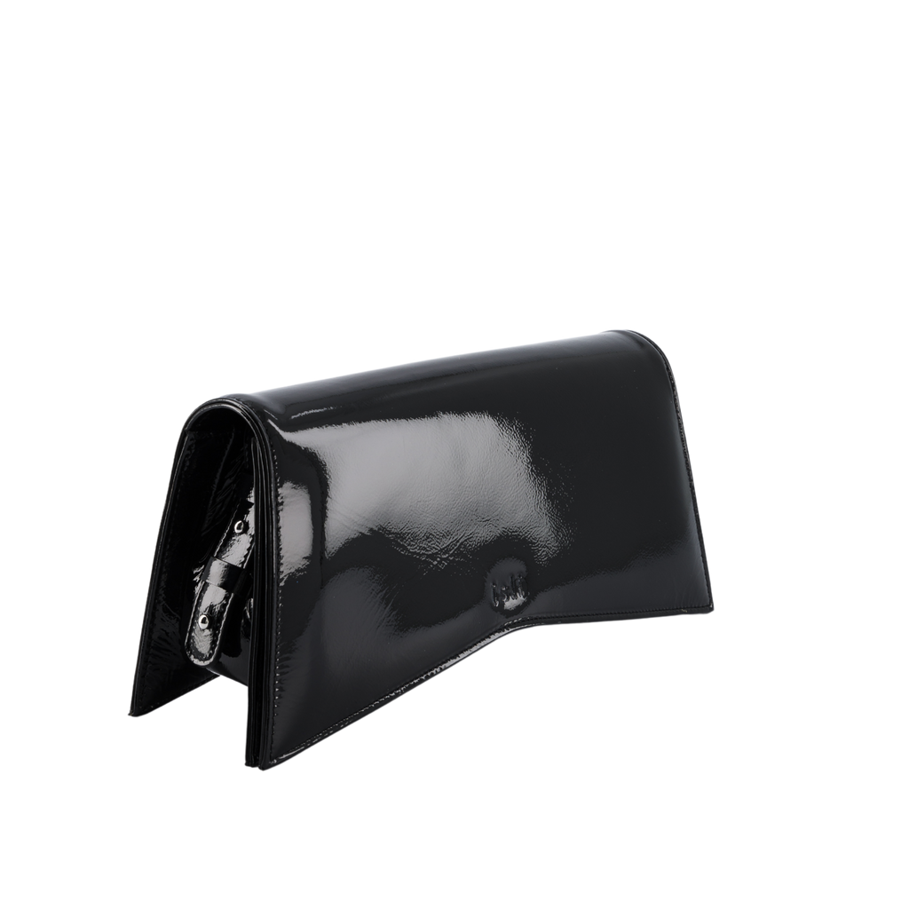 Jelija Bag in Black Patent, angled view showing the adjustable strap and metal clasp, ISLI Studio