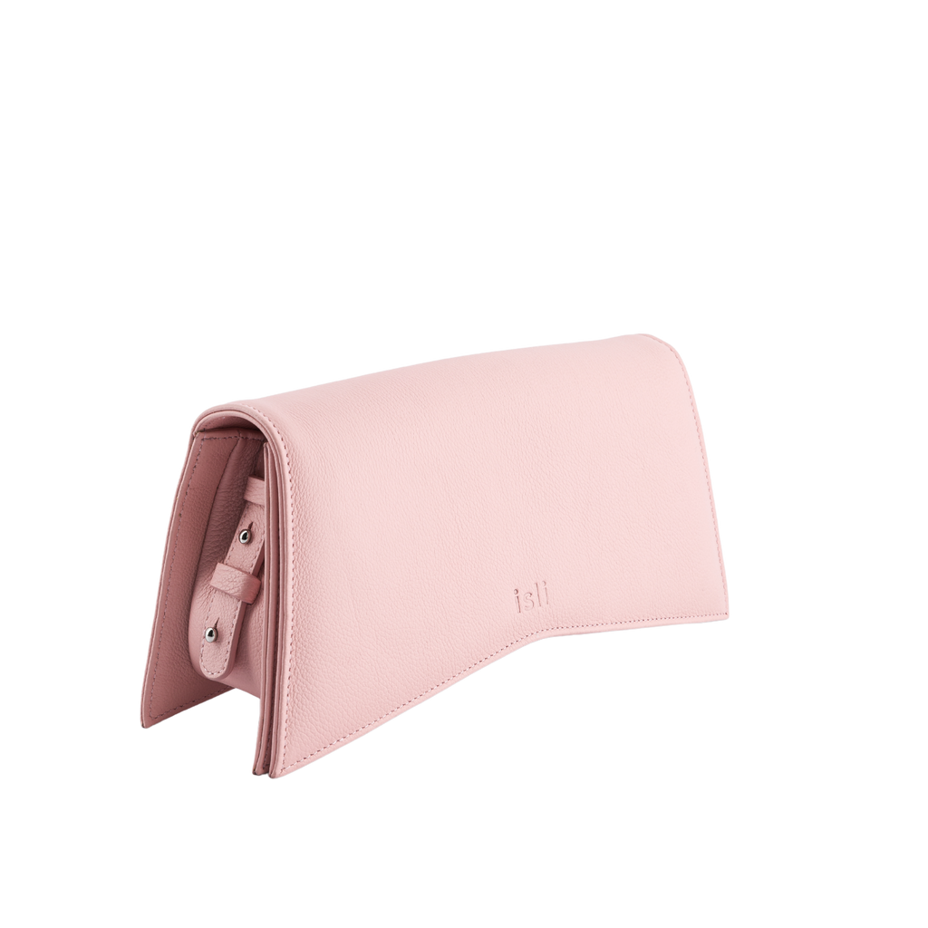 Jelija Bag in Pastel Pink, angled view showing the adjustable strap and metal clasp, ISLI Studio