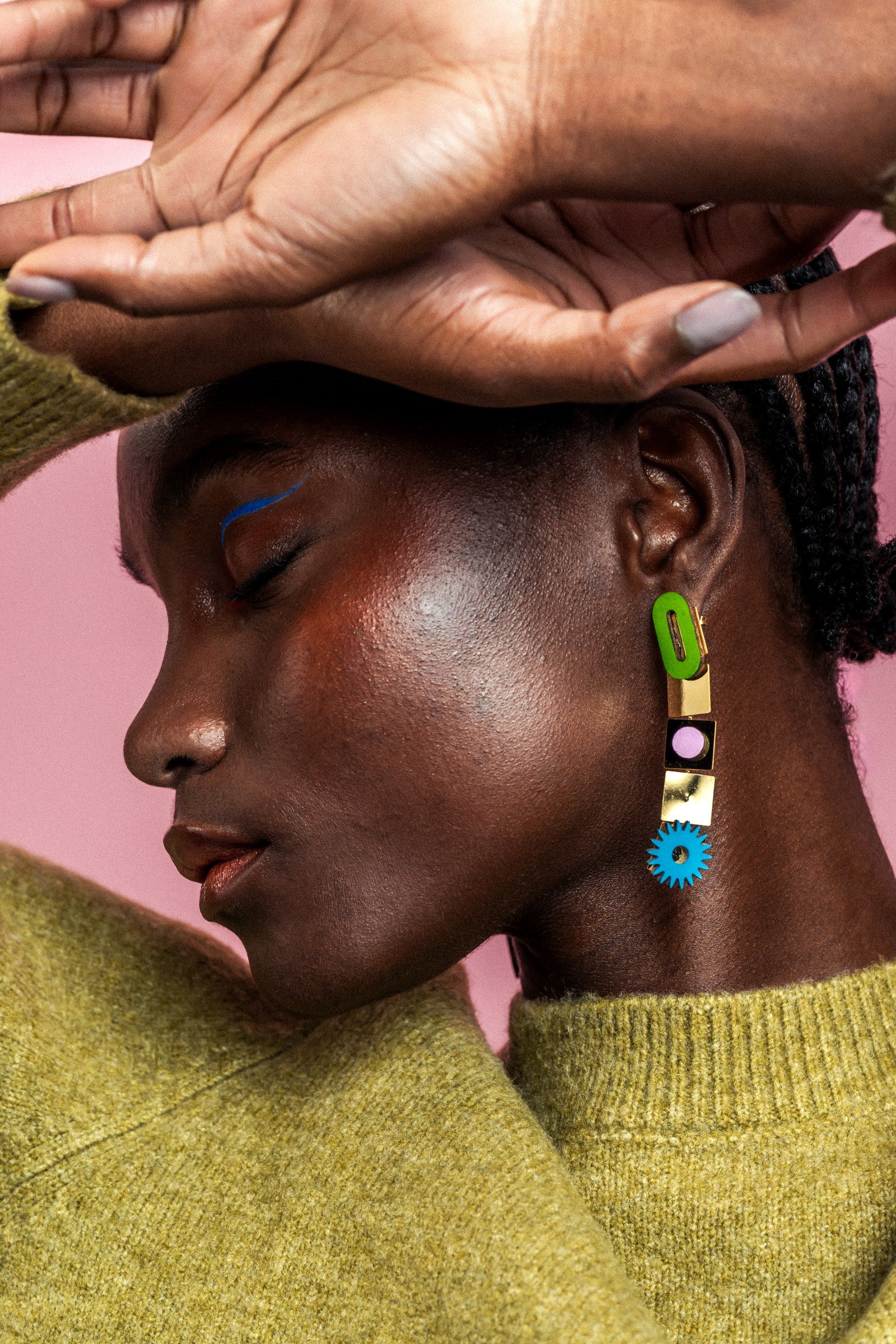 Awrir Soleil mixed-shape earrings with gold accents, close-up of the colorful geometric drops